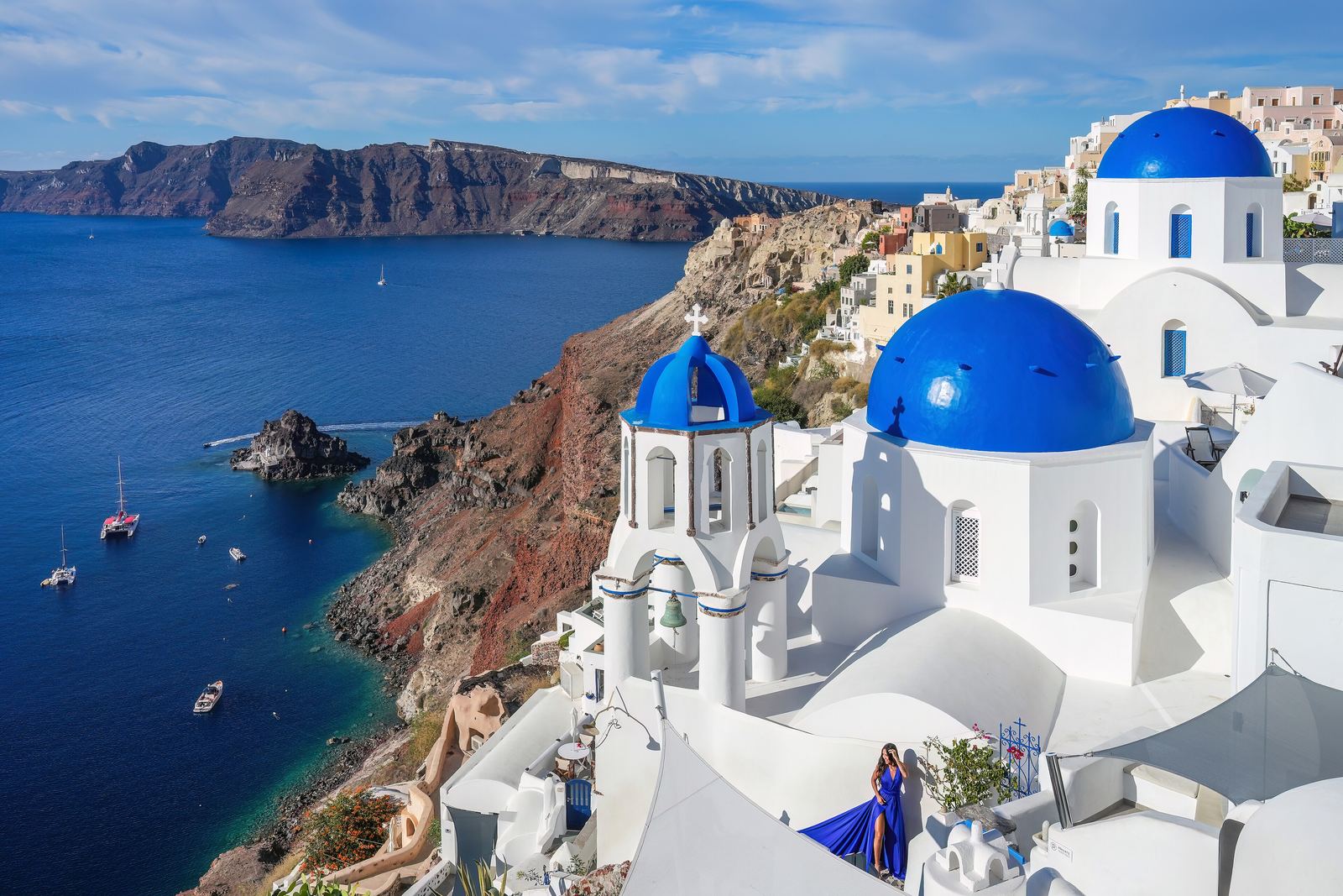 Blue-domed churches above the caldera at Oia, Santorini